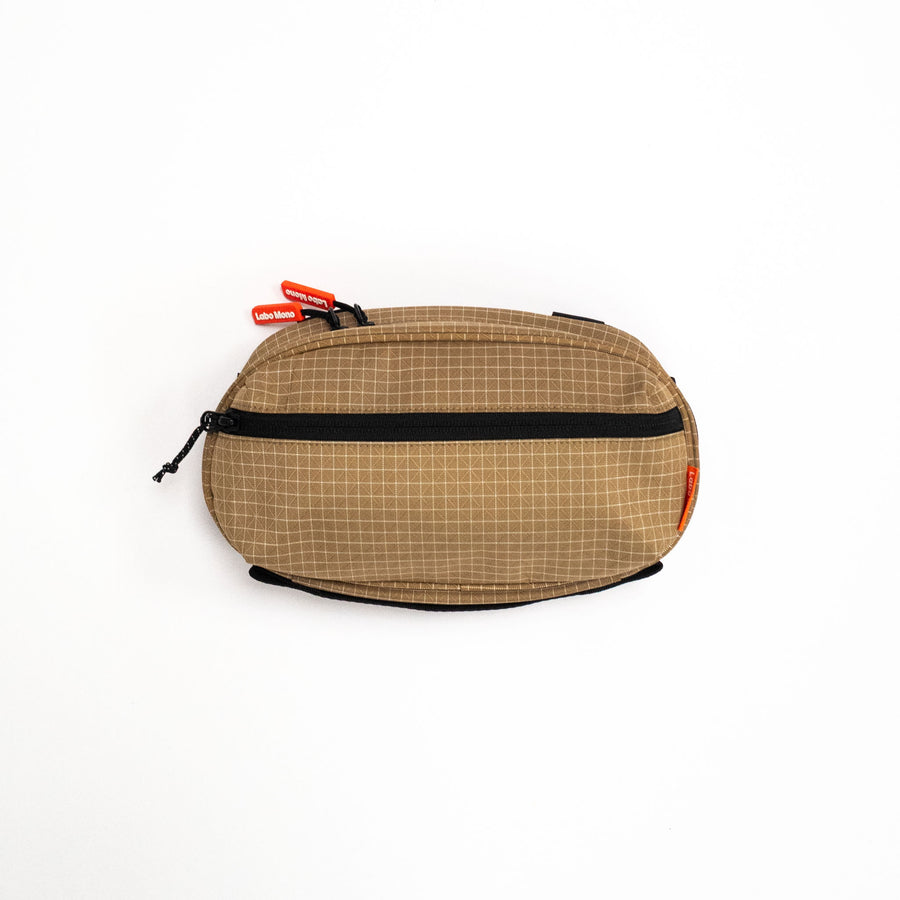Sling Bag - Medium in Dune, front view.