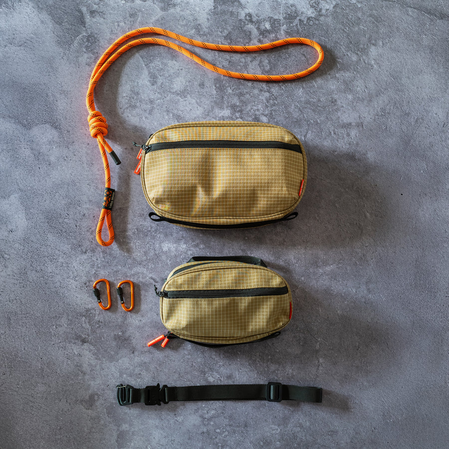 Medium and Large sling bags in Dune, shown with rope and flat strap options.