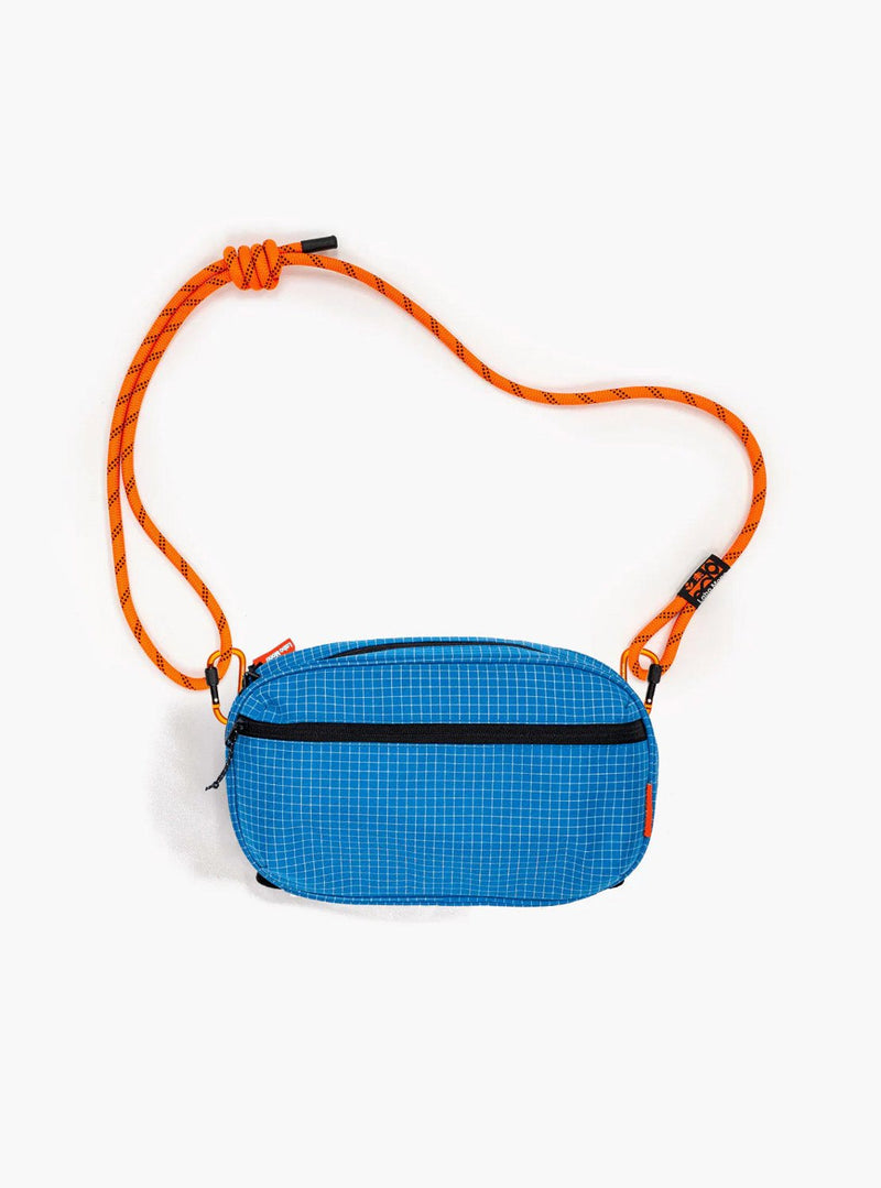 Large sling bag in Gridstop Blue with an orange rope strap