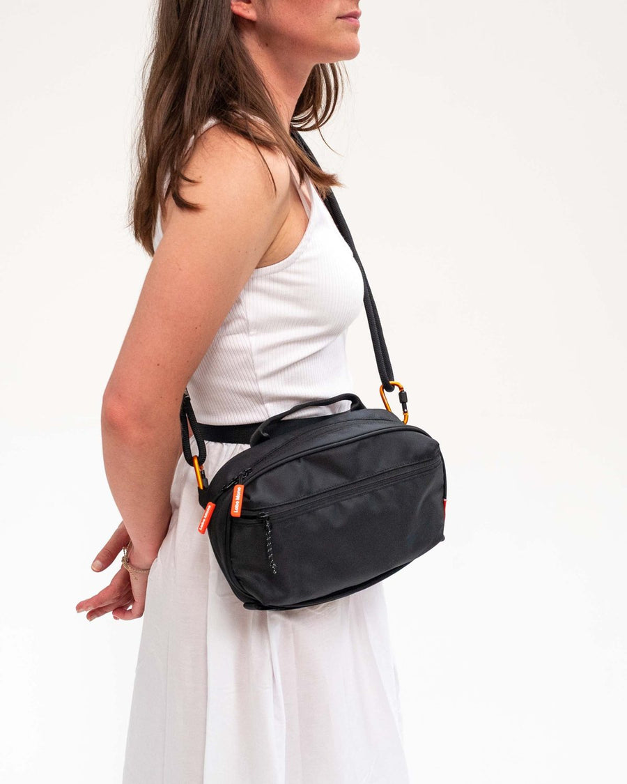 The Large sling bag worn at the hip