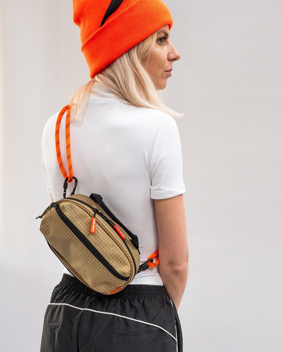 The Medium sling bag worn on the back