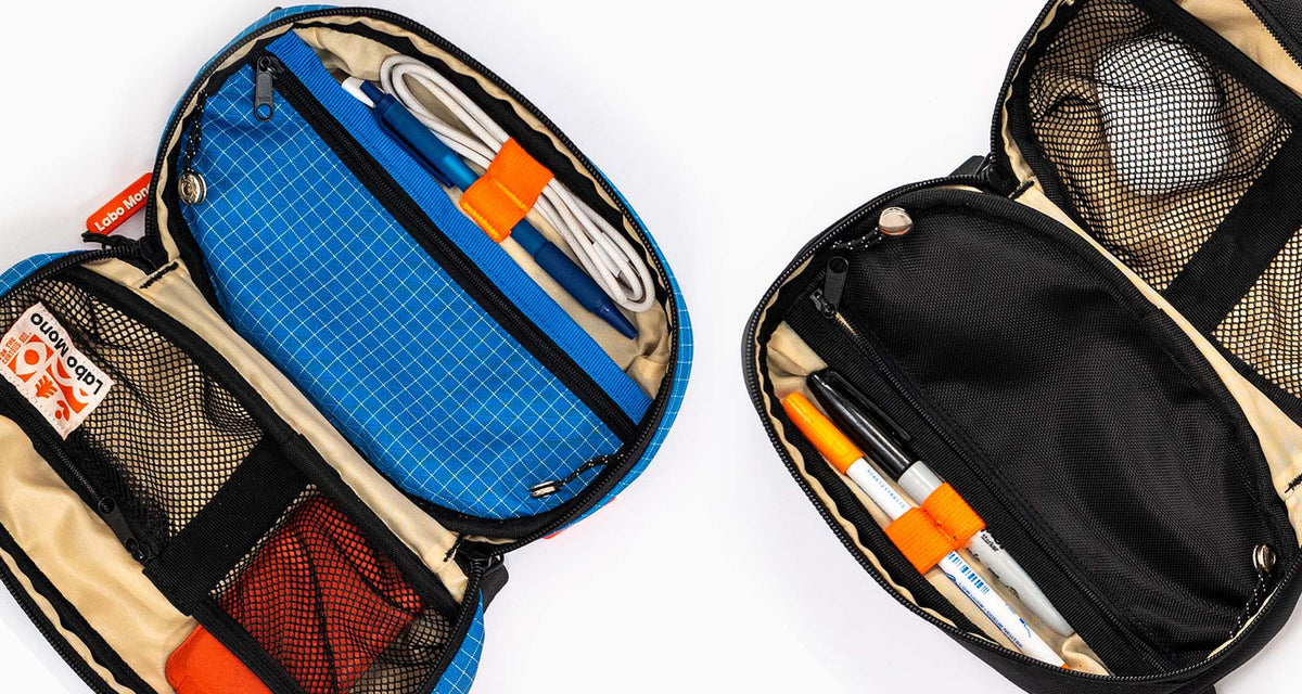 Two open sling bags showing every pocket filled