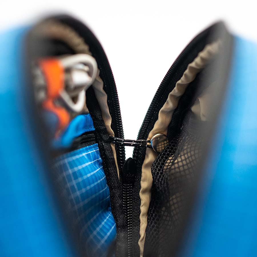 Close-up of the quick-release side lock holding the zip half open