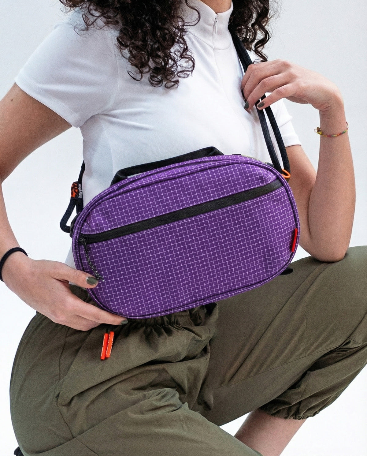 Sling Bag - Large in Ultraviolet, worn across the body.